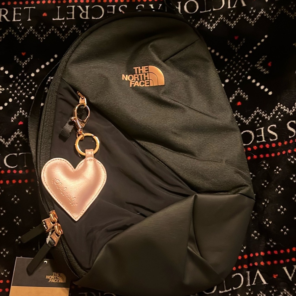 The north face Isabella sling bag. Rose gold black